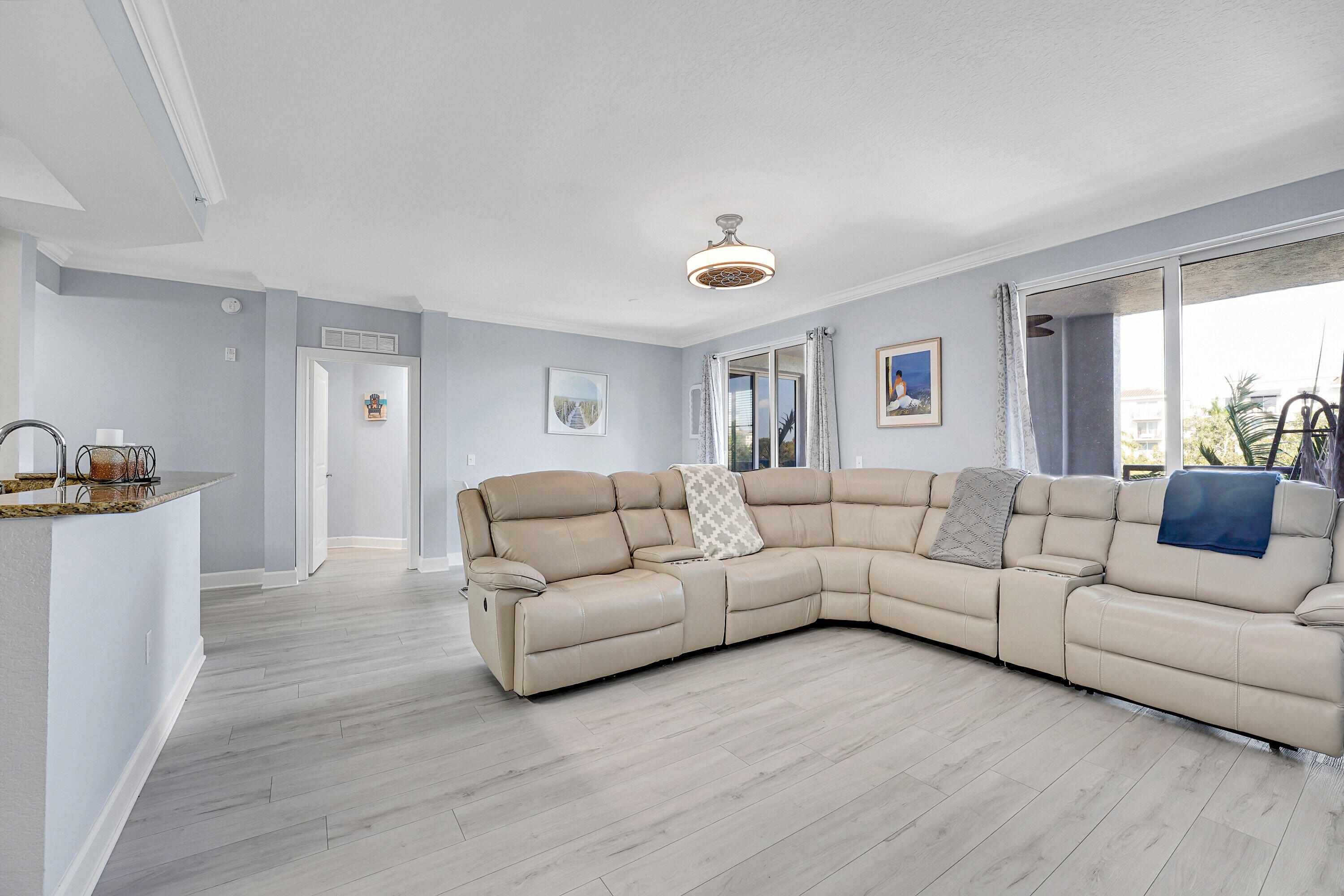 1690 Renaissance Commons Boulevard, Unit 1401 Boynton Beach, FL 33426 - Photo 7 of 43 a living room with furniture and a window