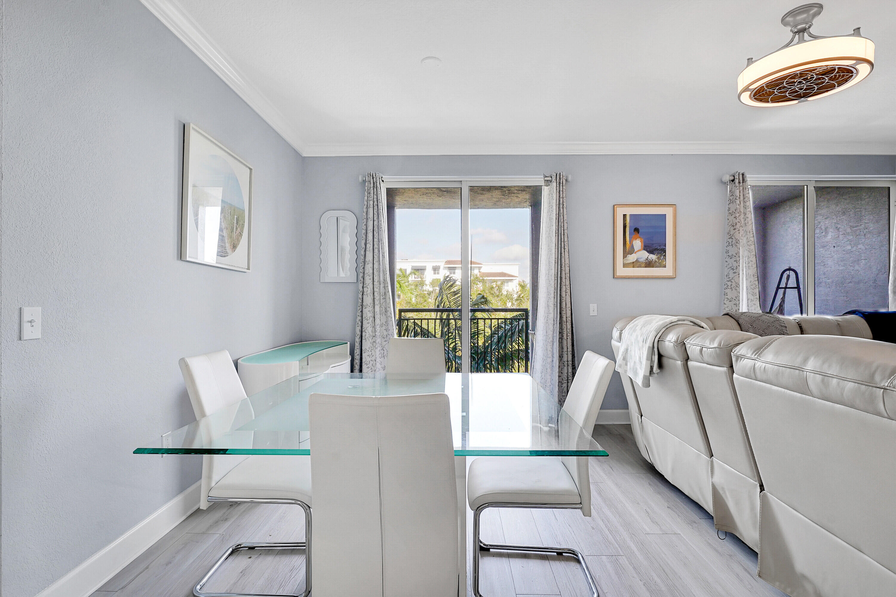 1690 Renaissance Commons Boulevard, Unit 1401 Boynton Beach, FL 33426 - Photo 10 of 43 a living room with furniture and a window