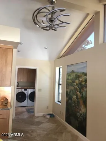 a view of a livingroom with furniture and a window