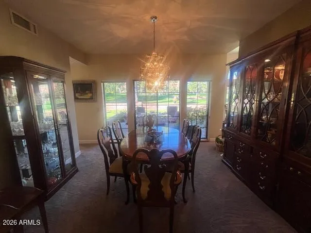 a view of a dining room with furniture window and outside view