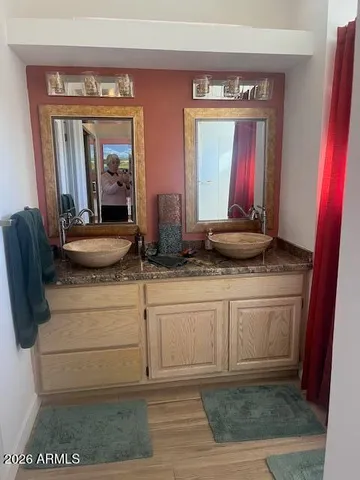 a bathroom with a sink and a mirror