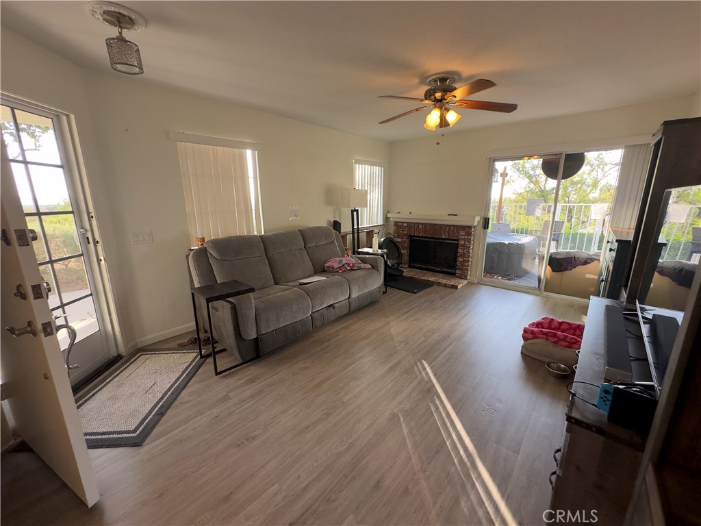 21045 Jenner Lake Forest, CA 92630 - Photo 1 of 1 a living room with furniture and a fireplace
