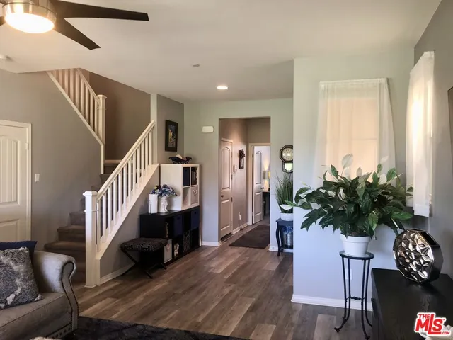 a kitchen with stainless steel appliances a refrigerator sink and cabinets