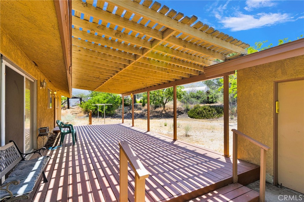 5500 Oil Well Road Phelan, CA 92371 - Photo 44 of 65 a patio with glass top table and chairs