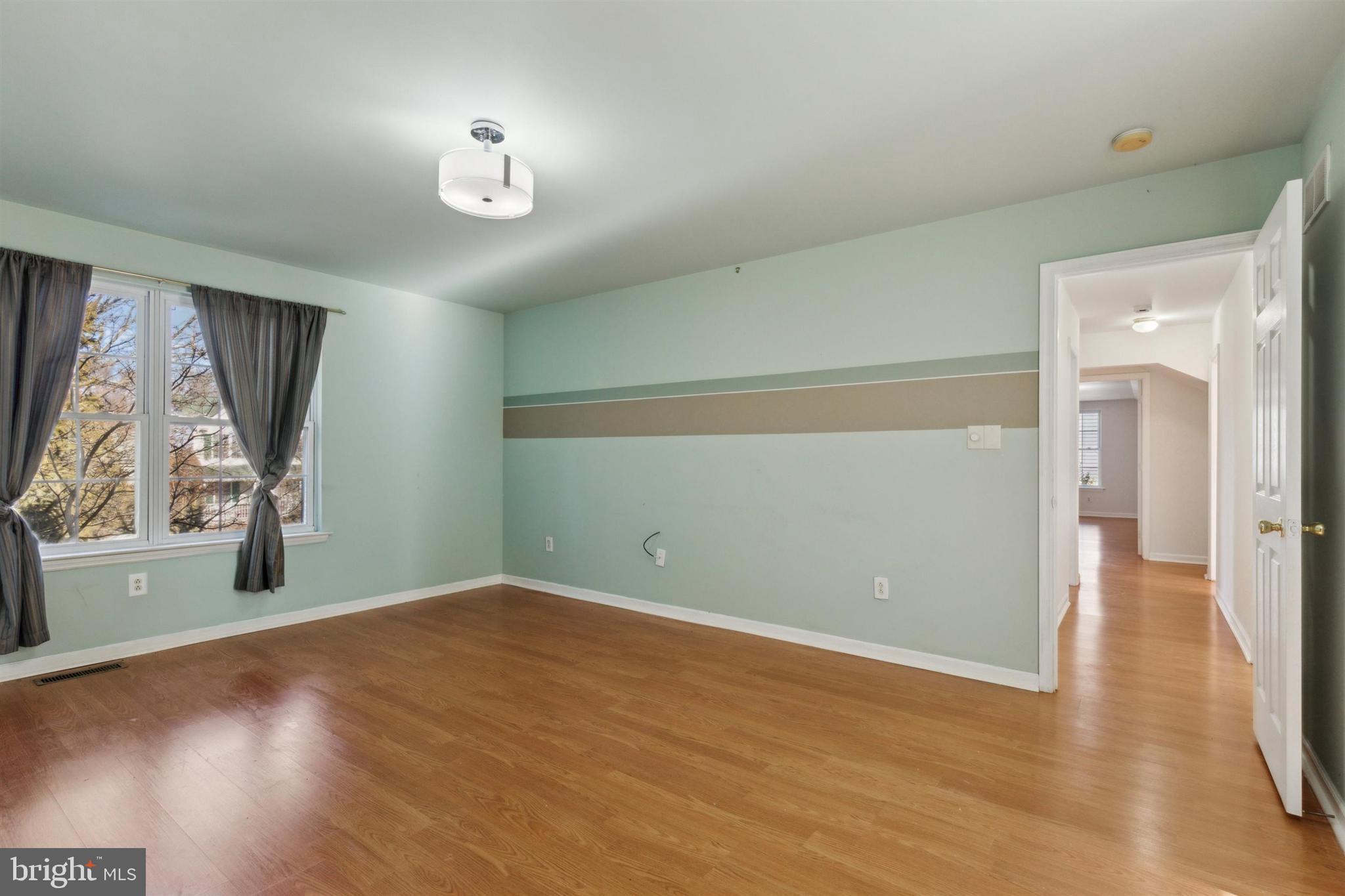 4420 Kelly Lane Reading, PA 19606 - Photo 14 of 25 an empty room with wooden floor and windows