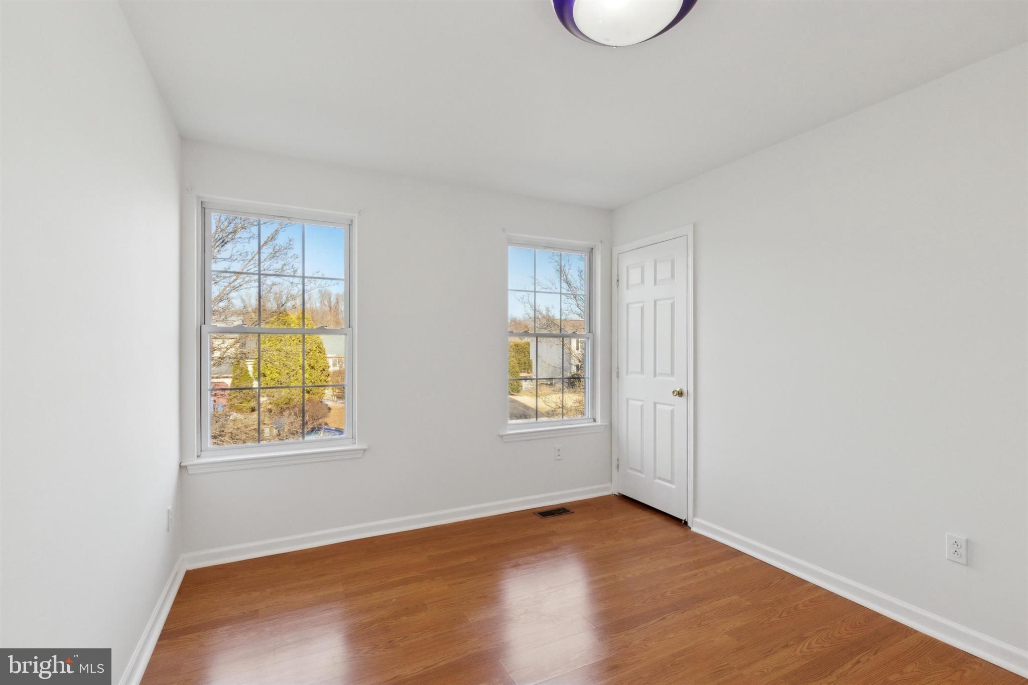 4420 Kelly Lane Reading, PA 19606 - Photo 17 of 25 an empty room with wooden floor and windows