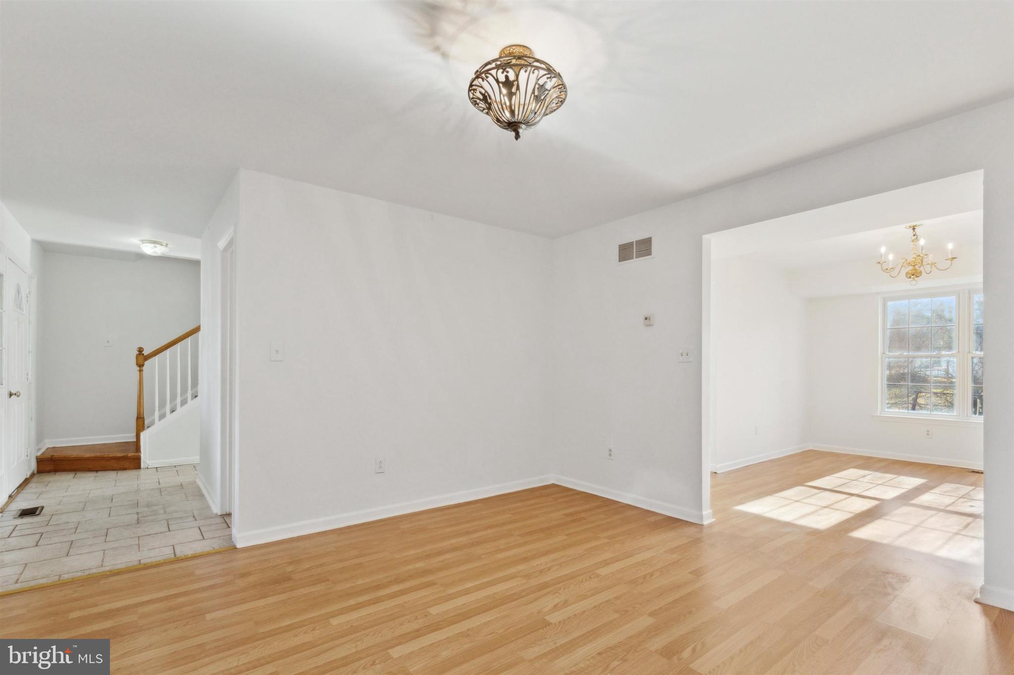 4420 Kelly Lane Reading, PA 19606 - Photo 5 of 25 a view of an empty room with wooden floor and a window