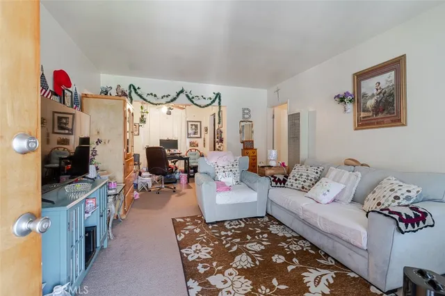 a kitchen with kitchen island a sink stove and refrigerator