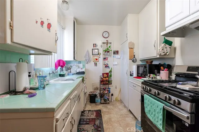 a bathroom with a sink vanity mirror and toilet