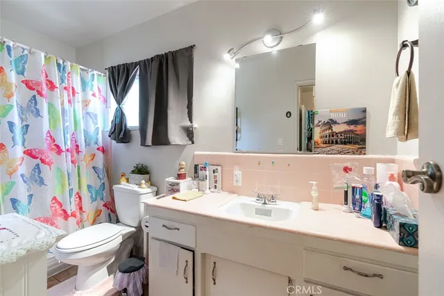 a bedroom with two beds and a dresser