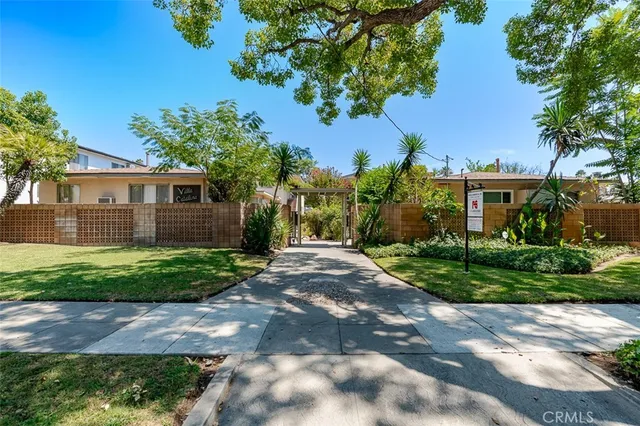 a view of a palm trees in front of a house