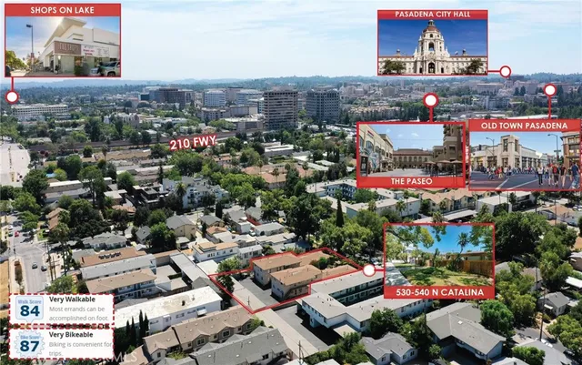 an aerial view of residential houses with outdoor space and parking