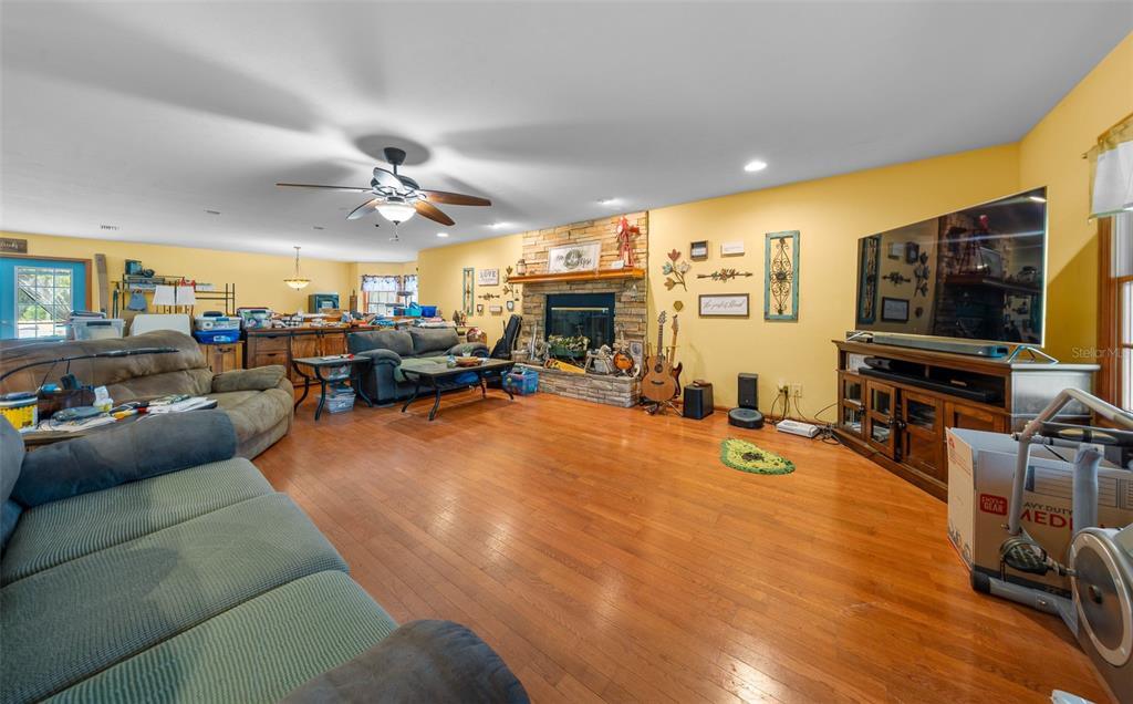 732 Carl Wilson Road Fort White, FL 32038 - Photo 16 of 80 a view of a livingroom with furniture and a flat screen tv