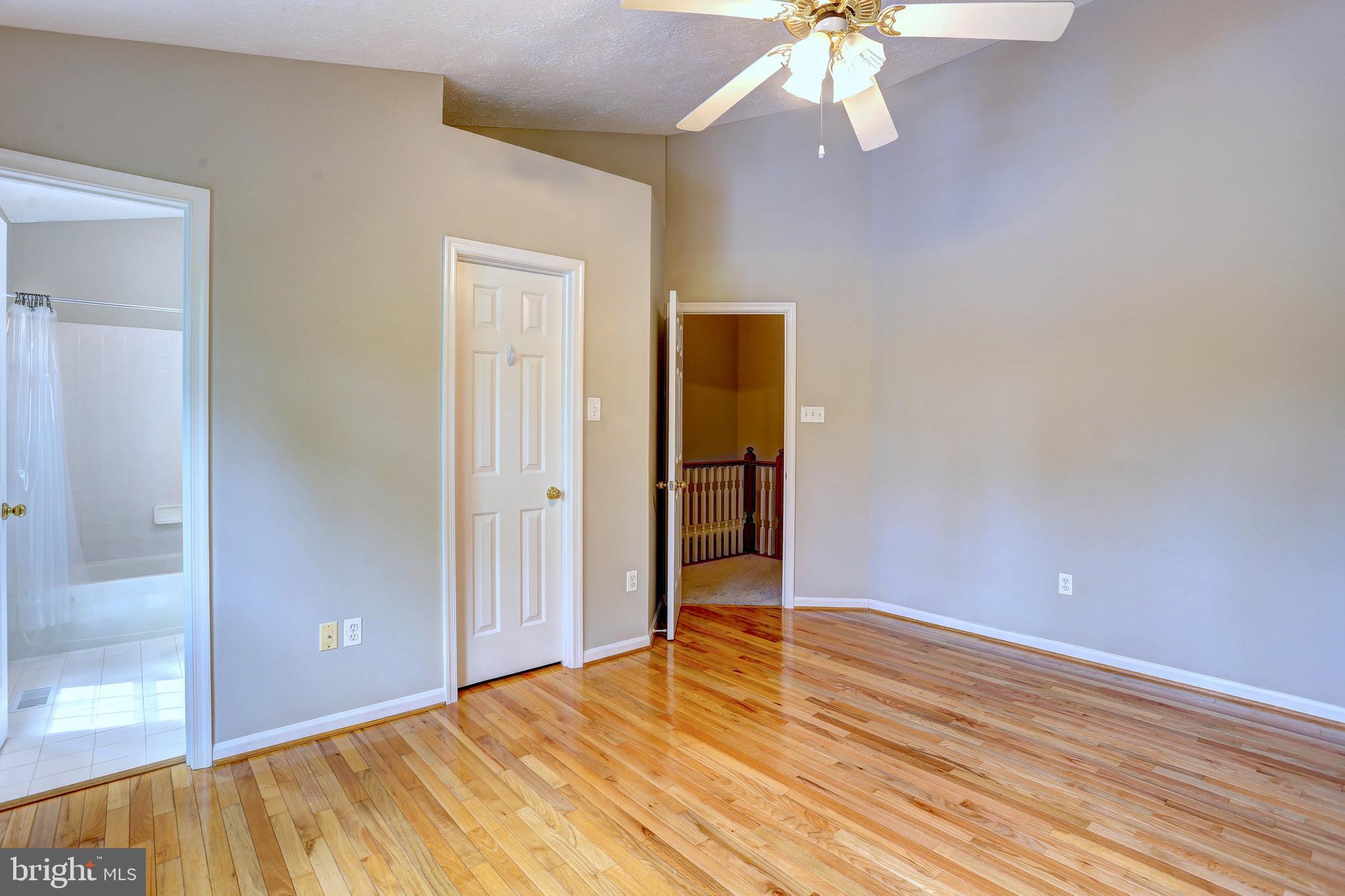 6136 Starburn Path Columbia, MD 21045 - Photo 15 of 35 wooden floor in an empty room with a window