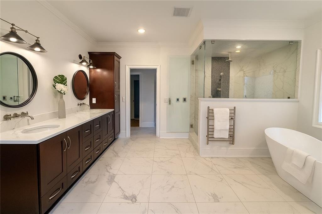 2928 Lavista Road Decatur, GA 30033 - Photo 13 of 15 a spacious bathroom with a double vanity sink and a mirror