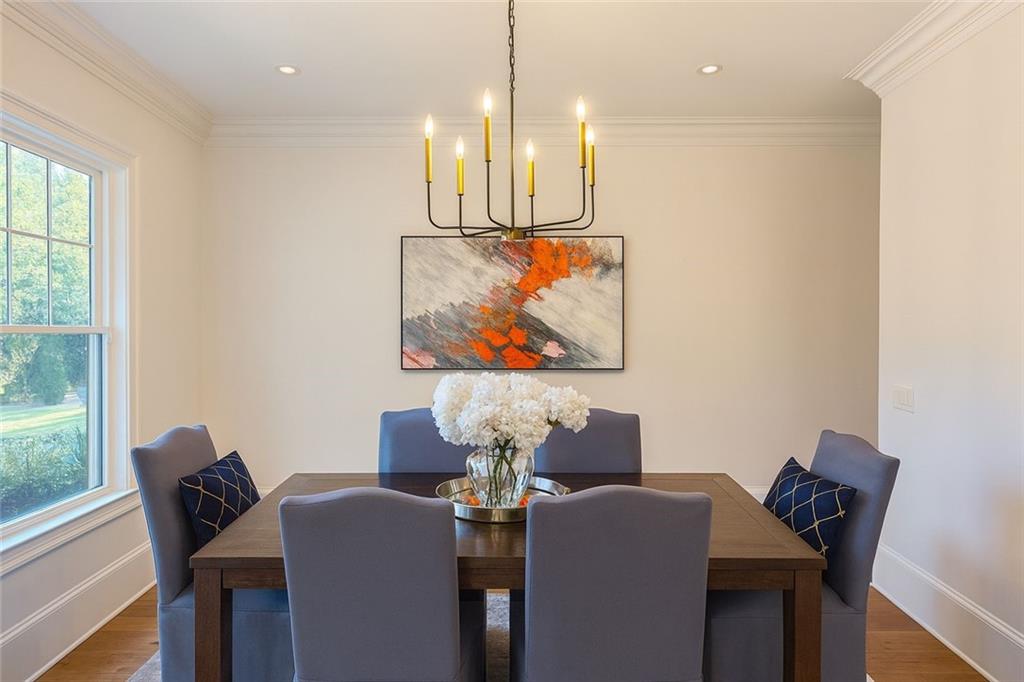 2928 Lavista Road Decatur, GA 30033 - Photo 3 of 15 a dining room with furniture and wooden floor