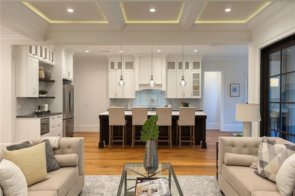 2928 Lavista Road Decatur, GA 30033 - Photo 5 of 15 a large living room with stainless steel appliances kitchen island granite countertop a couch and a view of living room
