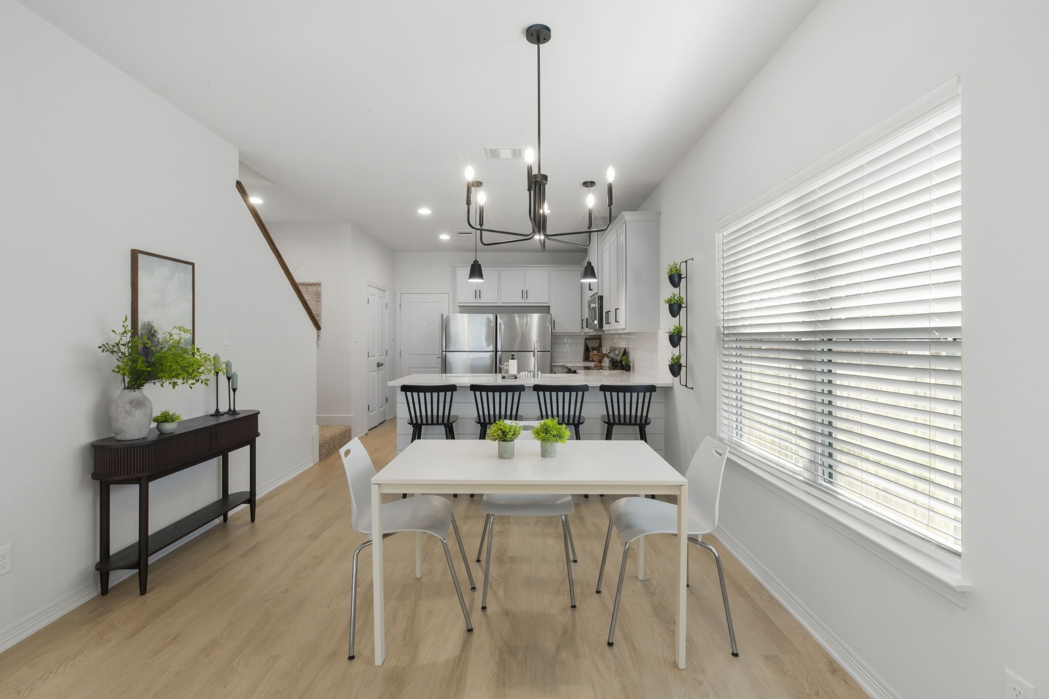 228 Richards Street College Station, TX 77840 - Photo 11 of 43 a view of a dining room with furniture and a chandelier