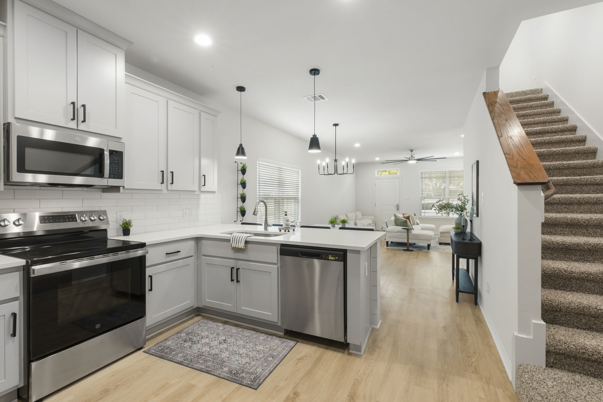 228 Richards Street College Station, TX 77840 - Photo 17 of 43 a kitchen with sink cabinets and stainless steel appliances