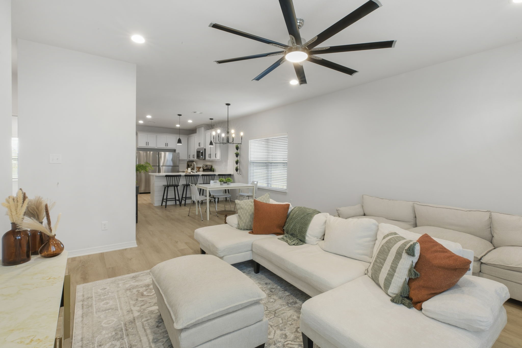 228 Richards Street College Station, TX 77840 - Photo 2 of 43 a living room with furniture and a view of kitchen