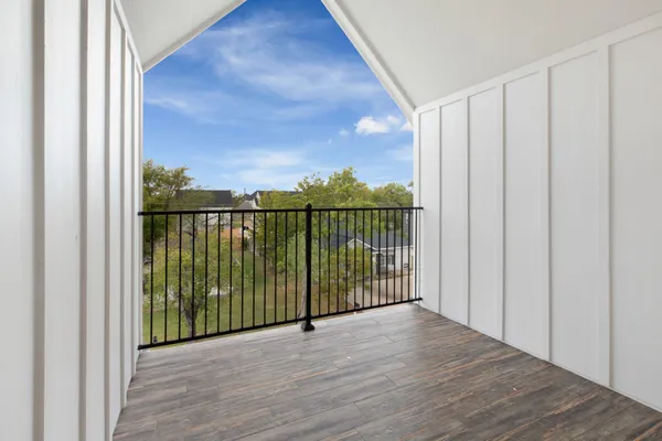 a view of a balcony with furniture