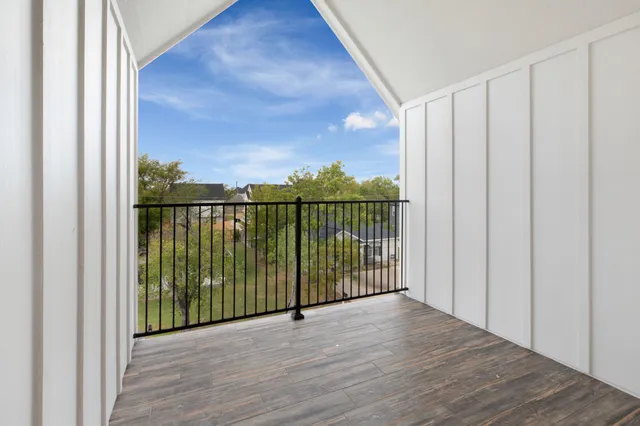 a view of a balcony with furniture