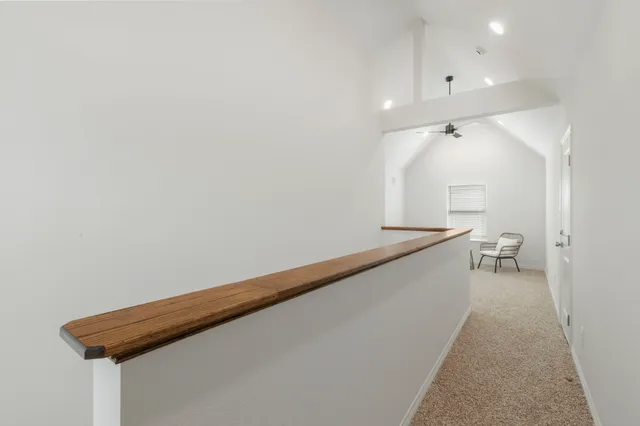 an empty room with a cabinet and mirror