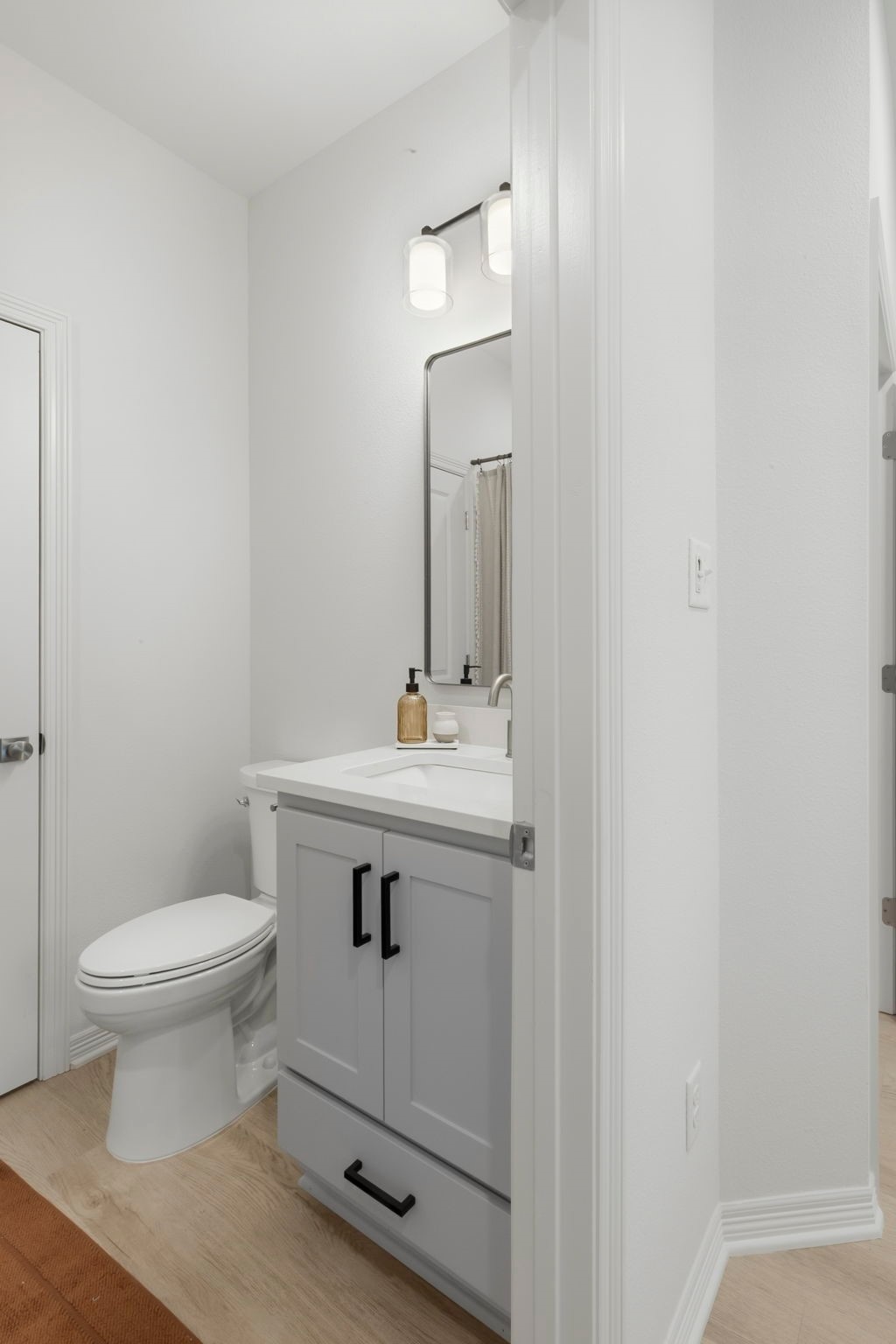 228 Richards Street College Station, TX 77840 - Photo 41 of 43 a bathroom with a sink toilet and a mirror