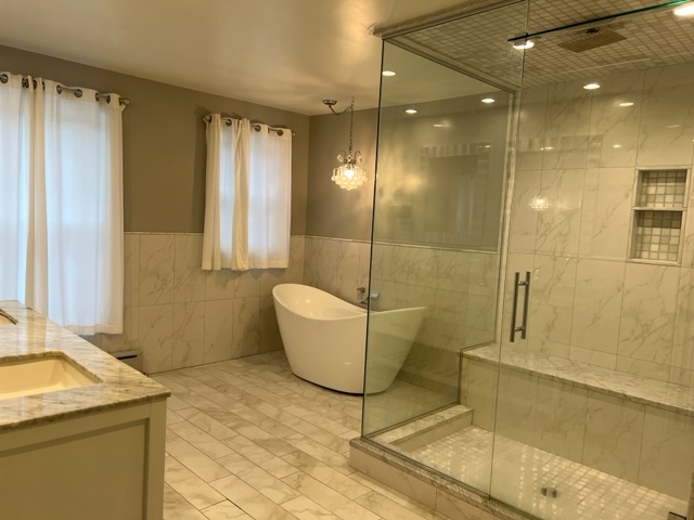 14935 West Old School Road Mettawa, IL 60048 - Photo 19 of 65 a bathroom with a granite countertop sink a toilet and bathtub