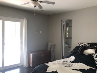 14935 West Old School Road Mettawa, IL 60048 - Photo 22 of 65 a bedroom with a bed and a chandelier