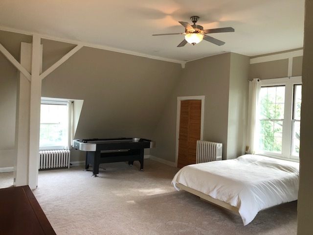 14935 West Old School Road Mettawa, IL 60048 - Photo 26 of 65 a bedroom with a bed and a chandelier