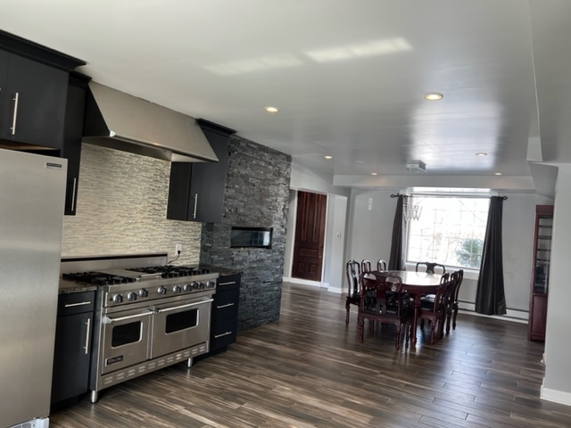 14935 West Old School Road Mettawa, IL 60048 - Photo 48 of 65 a kitchen with stainless steel appliances a stove a table and chairs