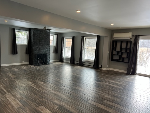14935 West Old School Road Mettawa, IL 60048 - Photo 50 of 65 an empty room with wooden floor and windows