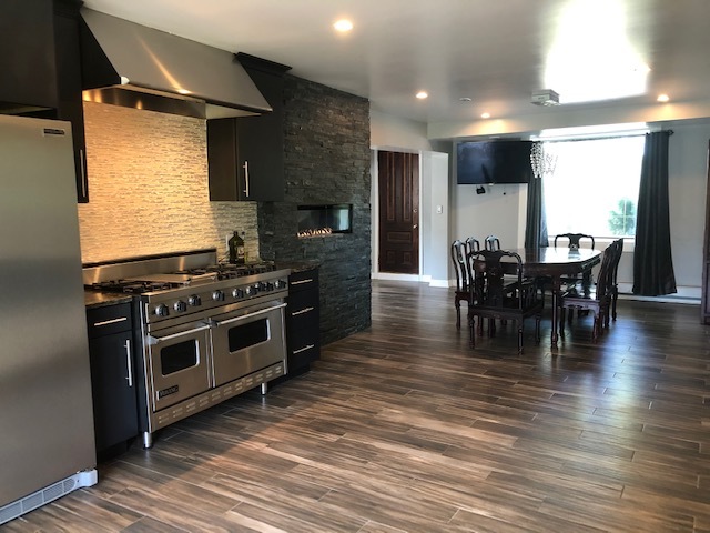 14935 West Old School Road Mettawa, IL 60048 - Photo 10 of 65 a kitchen with stainless steel appliances granite countertop a stove and a wooden floors