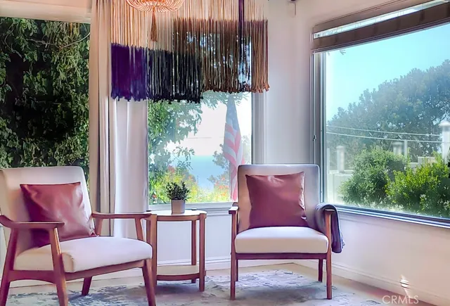 a view of a chair and table in the balcony