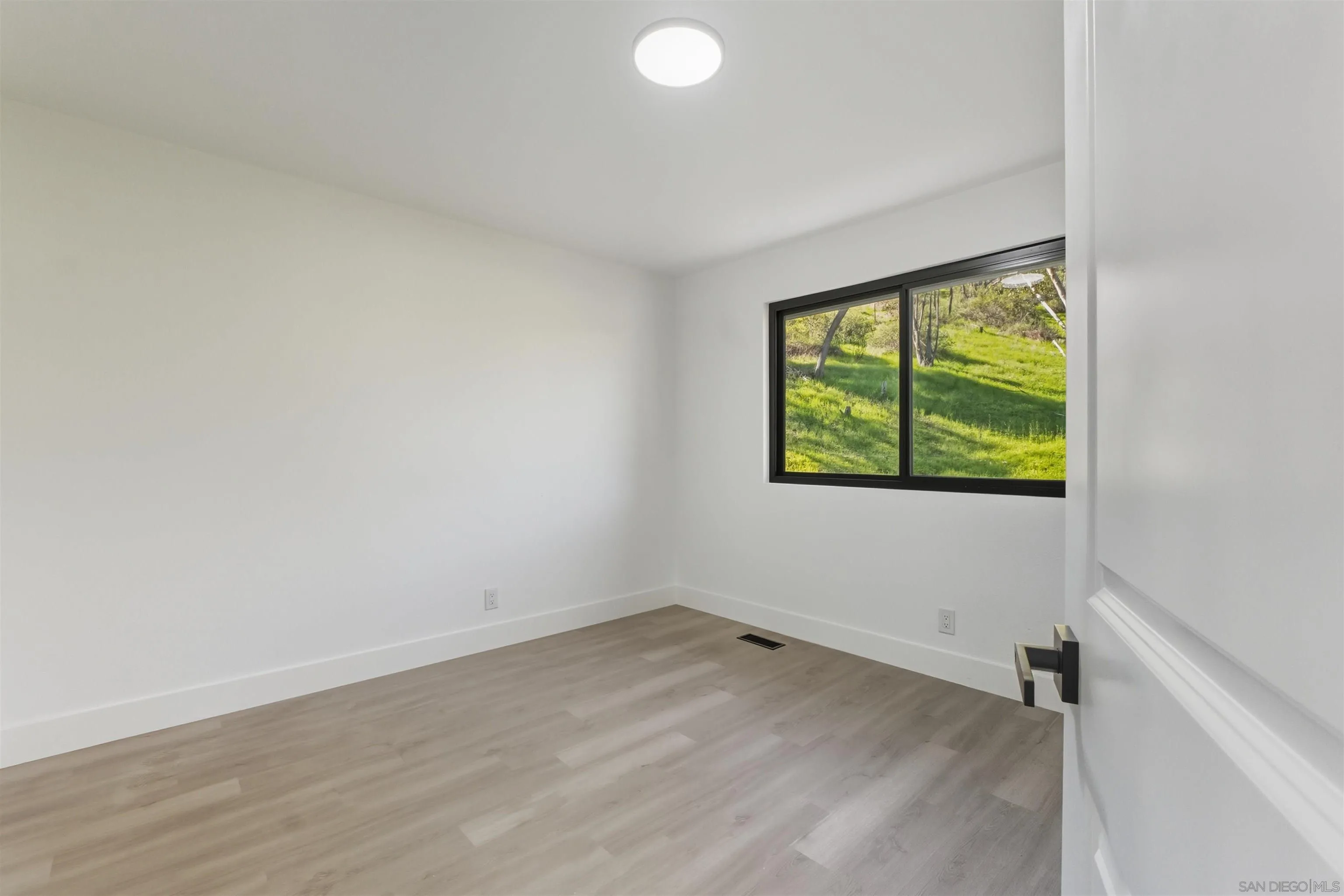 11618 Johnson Lake Road Lakeside, CA 92040 - Photo 14 of 25 an empty room with a window