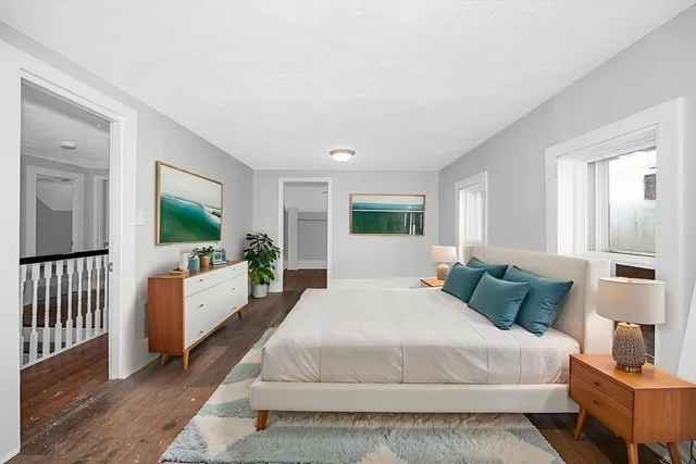 a bed room with a bed and a television