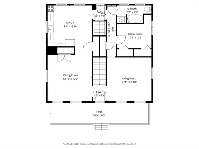 a picture of a bench in front of a wall