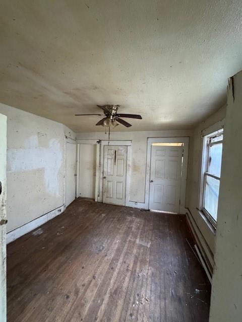 3900 Colonial Avenue Dallas, TX 75215 - Photo 5 of 15 an empty room with wooden floor cabinet and windows