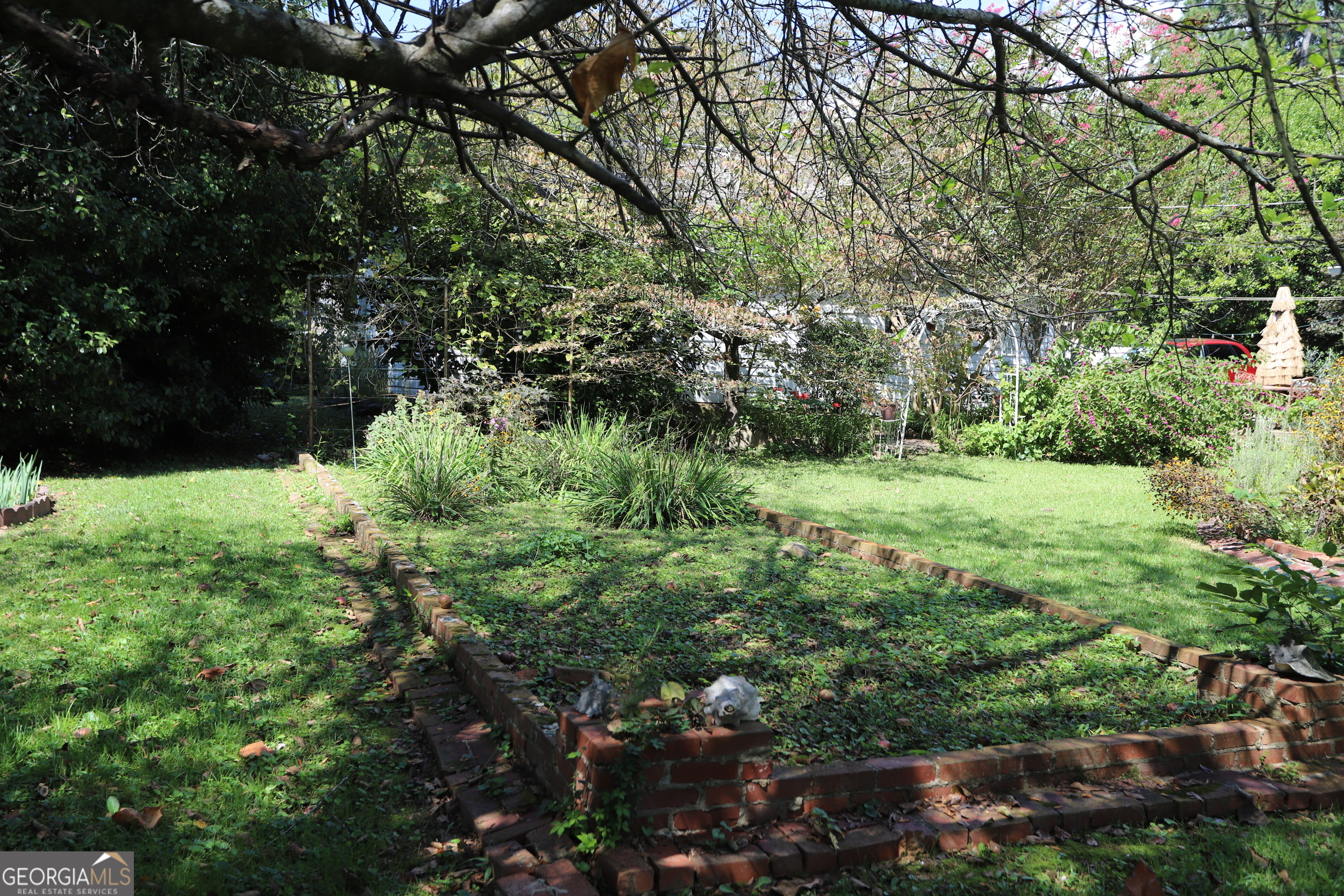 360 Edison Street Menlo, GA 30731 - Photo 12 of 64 a view of a garden with plants