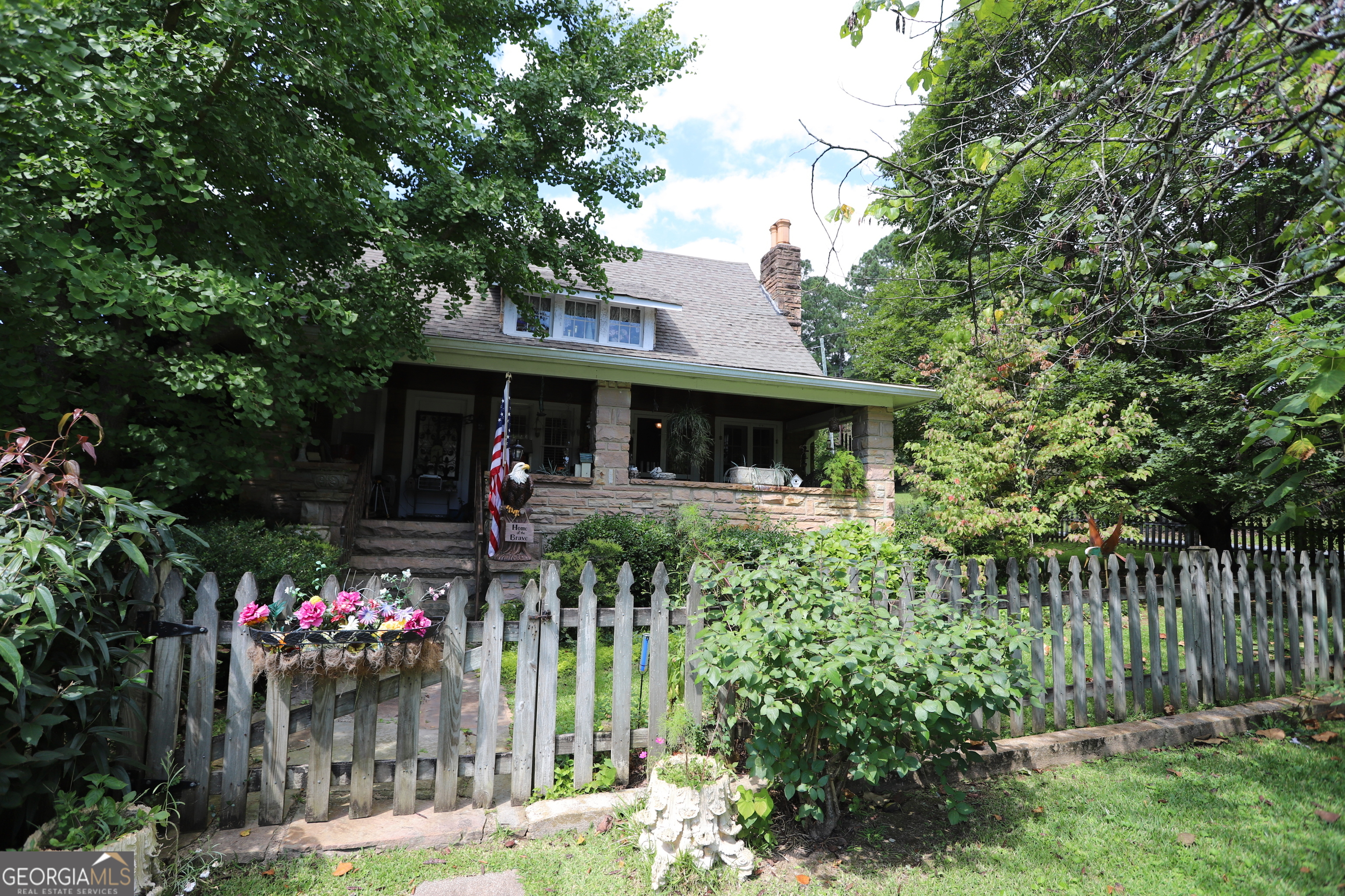 360 Edison Street Menlo, GA 30731 - Photo 17 of 64 a front view of a house with a porch