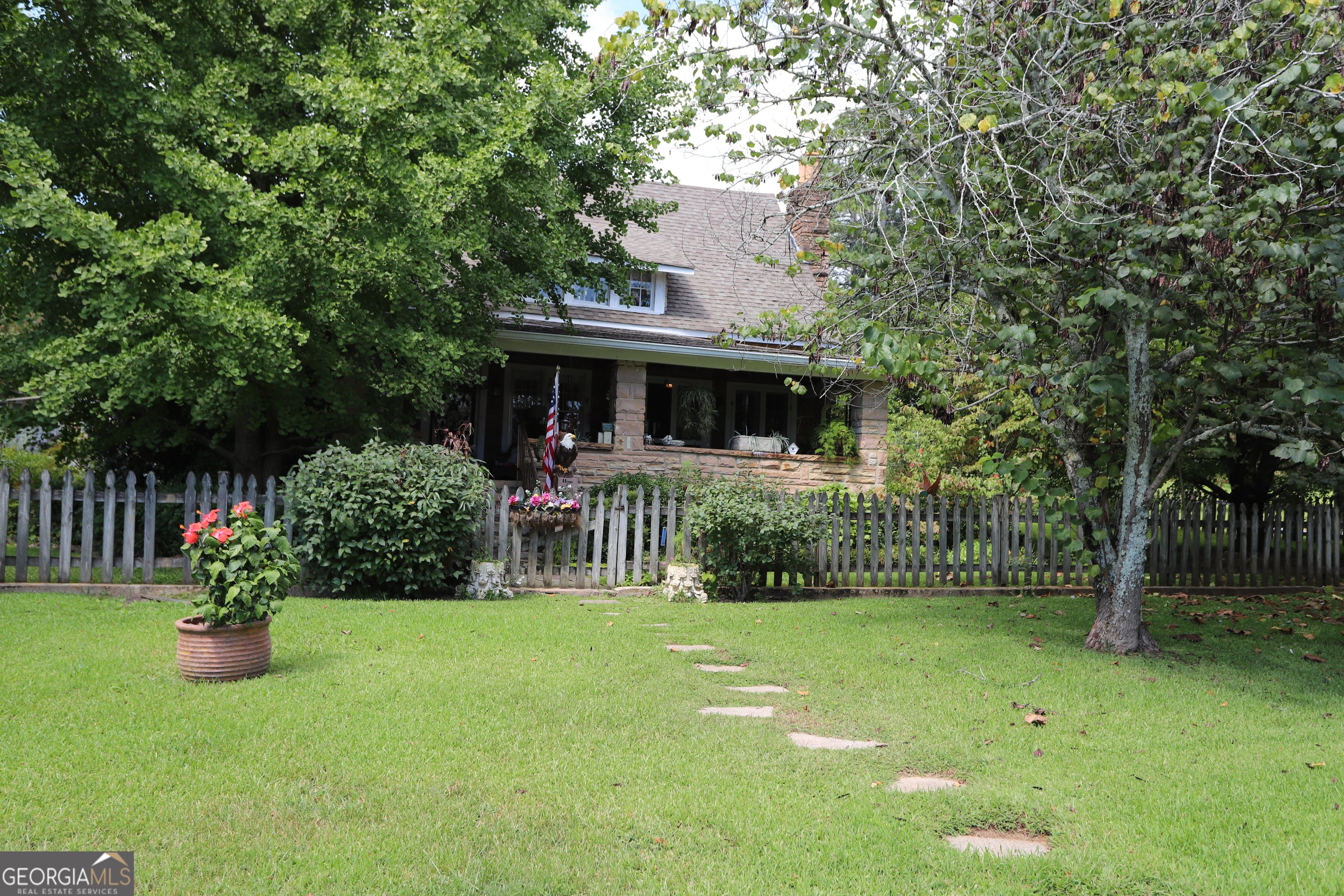 360 Edison Street Menlo, GA 30731 - Photo 18 of 64 a view of house with a yard and potted plants