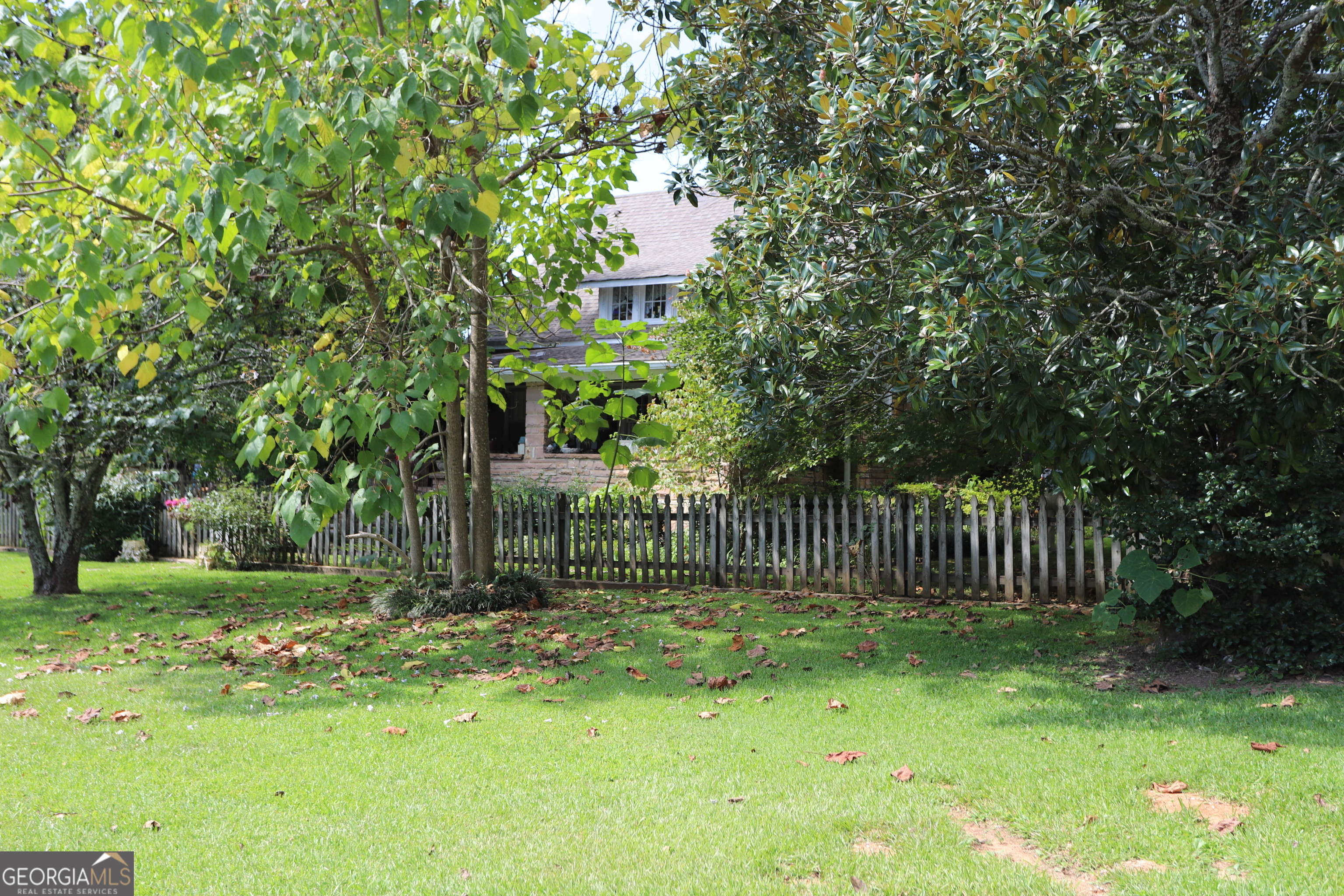 360 Edison Street Menlo, GA 30731 - Photo 21 of 64 a view of a bench in a backyard