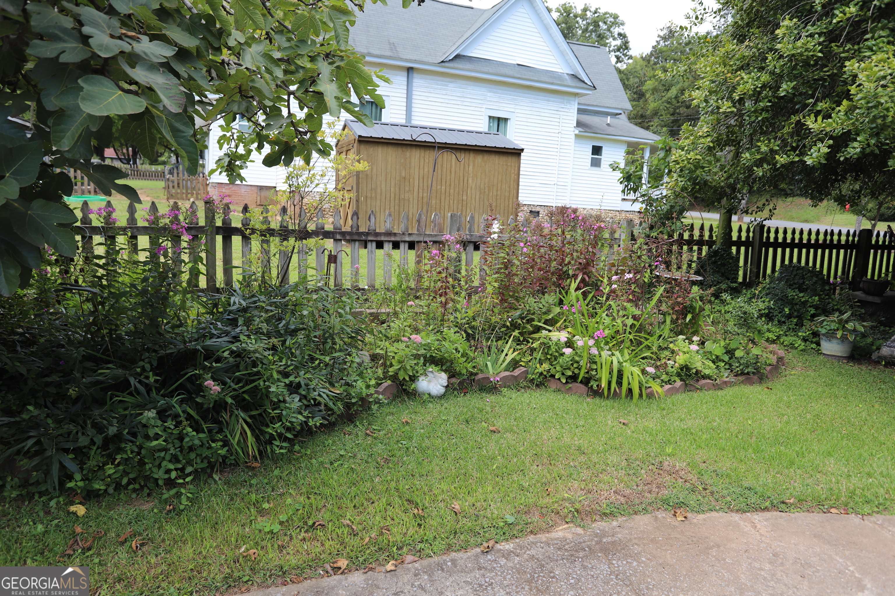 360 Edison Street Menlo, GA 30731 - Photo 27 of 64 a view of a house with a yard and plants