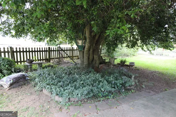 a very nice looking dining room with furniture