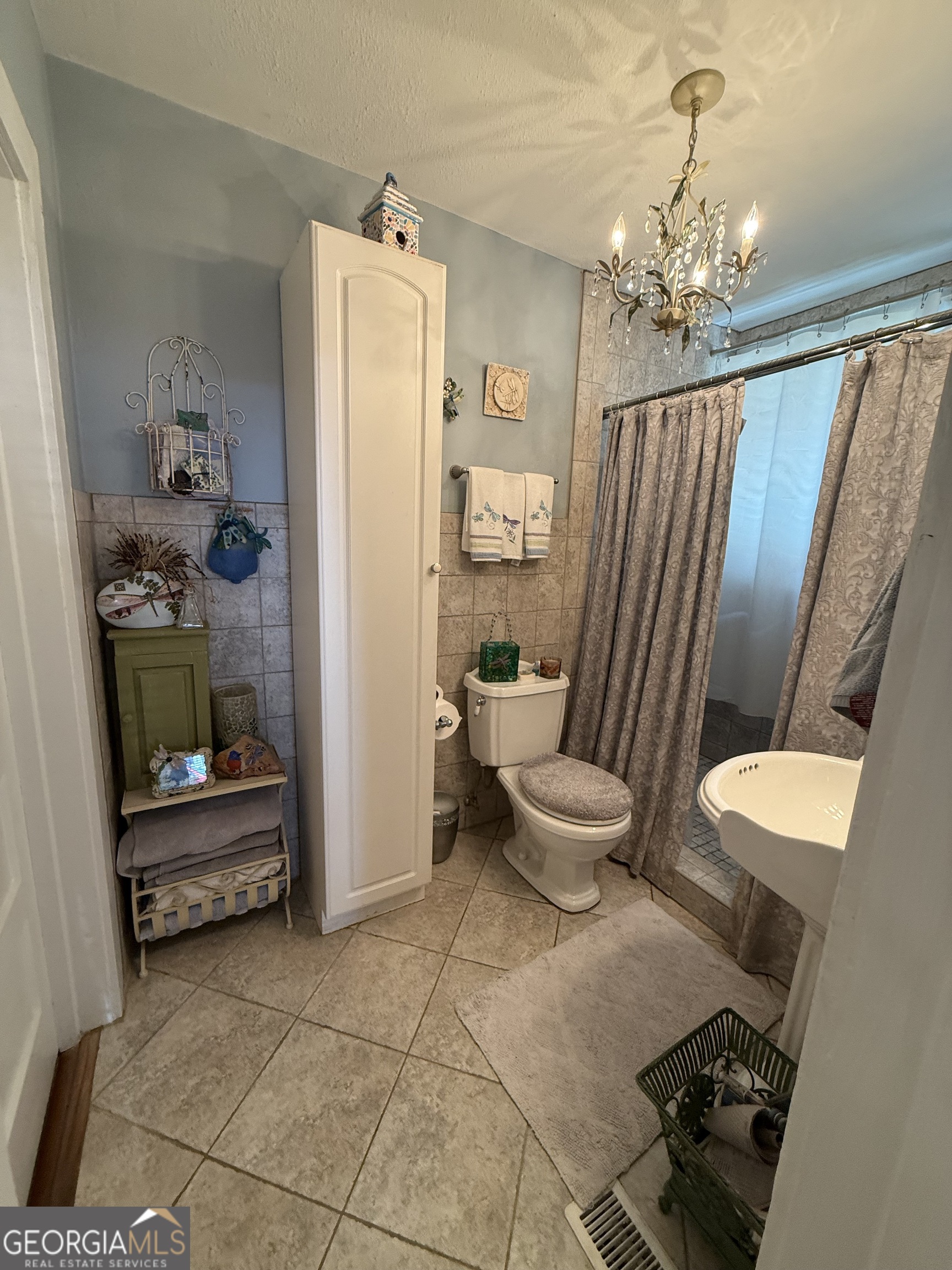 360 Edison Street Menlo, GA 30731 - Photo 34 of 64 a bathroom with a toilet a sink and shower