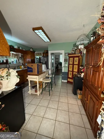 a living room with furniture a couch and dresser