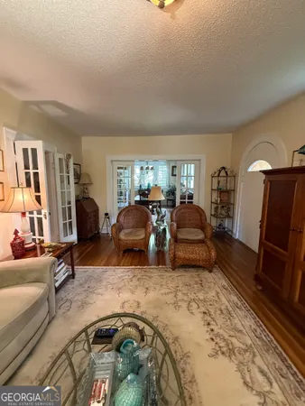 a bathroom with a double vanity sink toilet and a tub