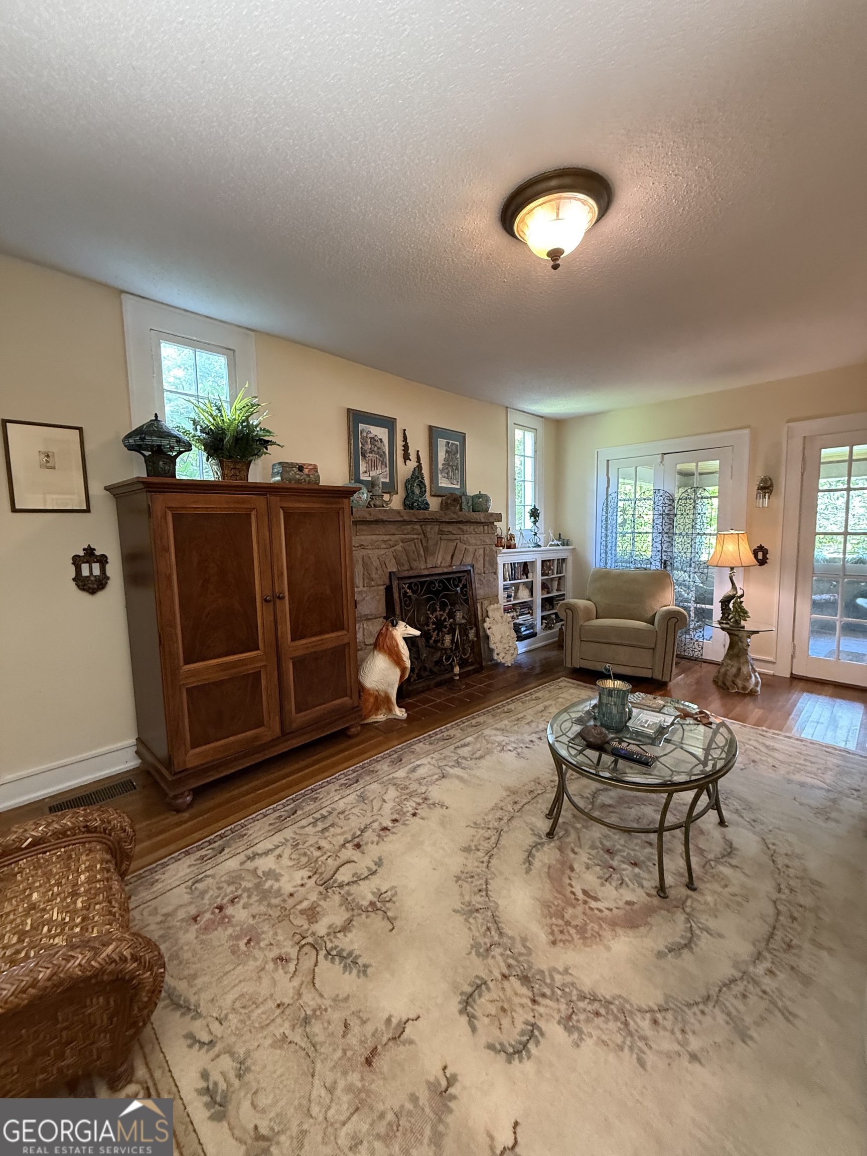 360 Edison Street Menlo, GA 30731 - Photo 49 of 64 a living room with furniture a fireplace and a window