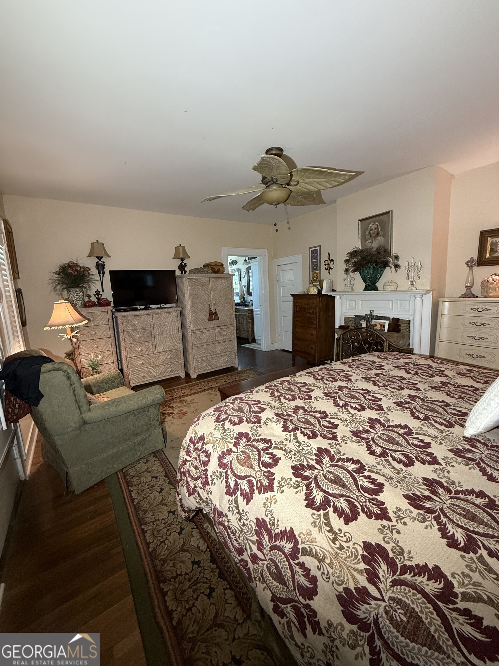 360 Edison Street Menlo, GA 30731 - Photo 55 of 64 a bedroom with a bed and a chandelier